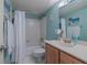 Bathroom with tub shower and updated vanity at 5501 S Atlantic Ave # 307, New Smyrna Beach, FL 32169