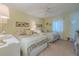 Guest bedroom with two double beds and a ceiling fan at 5501 S Atlantic Ave # 307, New Smyrna Beach, FL 32169