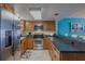 Kitchen with stainless steel appliances and wood cabinets at 5501 S Atlantic Ave # 307, New Smyrna Beach, FL 32169