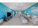 Living room with ocean view, comfortable seating and a TV at 5501 S Atlantic Ave # 307, New Smyrna Beach, FL 32169
