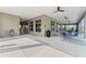 Covered patio with tables, chairs, and access to the pool at 1665 Three Bars Rd, Kissimmee, FL 34744