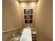 Modern staircase with neutral walls and artwork at 7471 Brooklyn Dr, Kissimmee, FL 34747