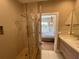 Spa-like bathroom with shower and view of bedroom at 7471 Brooklyn Dr, Kissimmee, FL 34747