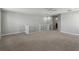 Large bonus room with carpeted floor and white railing at 1546 Water Elm Ct, Orlando, FL 32825