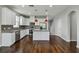 Modern kitchen with white cabinets, granite countertops and island at 1546 Water Elm Ct, Orlando, FL 32825