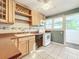 Kitchen with light wood cabinets, tile floors and modern appliances at 2509 Formosa Ave, Orlando, FL 32804