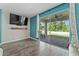 Gathering room with sliding glass doors leading to backyard patio at 5443 Carrara Ct, St Cloud, FL 34771