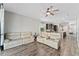 Spacious living room with light beige reclining sofas and wood-look flooring at 5443 Carrara Ct, St Cloud, FL 34771