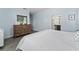 Main bedroom with dresser and ensuite bathroom access at 5443 Carrara Ct, St Cloud, FL 34771