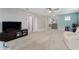 Spacious bonus room with carpeted flooring, TV, and seating at 5443 Carrara Ct, St Cloud, FL 34771