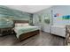 Bedroom with wood-paneled accent wall and large bed at 5443 Carrara Ct, St Cloud, FL 34771