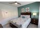 Spacious bedroom with king-size bed, ceiling fan, and ample closet space at 8954 California Palm Rd, Kissimmee, FL 34747