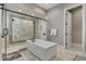 Large bathroom with soaking tub and walk in shower at 1110 Watson Ct, Reunion, FL 34747