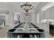 Open concept dining room with seating for twelve, adjacent to kitchen at 1110 Watson Ct, Reunion, FL 34747