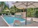 Relax in the refreshing pool and spa with comfortable seating at 1110 Watson Ct, Reunion, FL 34747