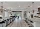 Open floor plan features a large kitchen island and spacious dining area at 1110 Watson Ct, Reunion, FL 34747