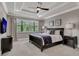 Spacious bedroom with a king-size bed and large window at 1110 Watson Ct, Reunion, FL 34747