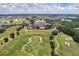 Aerial view of community with golf course and luxury homes at 1110 Watson Ct, Reunion, FL 34747