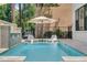 Inviting swimming pool with water features and lounge chairs at 1110 Watson Ct, Reunion, FL 34747