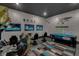 Fun game room with arcade games, TV's and air hockey at 1110 Watson Ct, Reunion, FL 34747