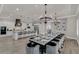 Open concept kitchen and dining area with modern appliances and large island at 1110 Watson Ct, Reunion, FL 34747