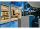 Relaxing pool area with patio furniture and outdoor bar at 1110 Watson Ct, Reunion, FL 34747