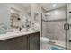 Bathroom with shower, toilet and vanity with a quartz countertop at 1110 Watson Ct, Reunion, FL 34747