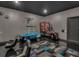 Playful game room features air hockey and arcade games at 1110 Watson Ct, Reunion, FL 34747