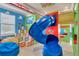 Toy Story themed bedroom with a slide and built in bunk beds at 1110 Watson Ct, Reunion, FL 34747
