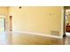 Living room with vaulted ceiling and tile floors at 125 Grand Junction Blvd, Orlando, FL 32835