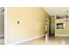 Open living room with tile floors and kitchen view at 125 Grand Junction Blvd, Orlando, FL 32835