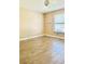 Simple bedroom with tile floors and window at 125 Grand Junction Blvd, Orlando, FL 32835