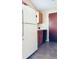 White fridge and wood cabinets in a galley style kitchen at 125 Grand Junction Blvd, Orlando, FL 32835