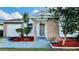 Charming one-story house with a brick facade and well-manicured lawn at 125 Grand Junction Blvd, Orlando, FL 32835