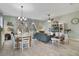 Spacious living room with teal sofa and dining area at 2160 Antilles Club Dr, Kissimmee, FL 34747