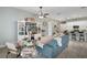 Living area with teal couch and built-in shelving at 2160 Antilles Club Dr, Kissimmee, FL 34747
