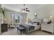 Main bedroom with a metal bed frame and window seating at 2160 Antilles Club Dr, Kissimmee, FL 34747