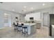 Open kitchen with an island, stainless steel appliances, and white and gray cabinets at 2160 Antilles Club Dr, Kissimmee, FL 34747