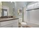 Clean bathroom with a shower/tub combo and dark countertop at 2160 Antilles Club Dr, Kissimmee, FL 34747