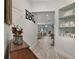 Bright entryway with wood floors and built-in shelving. View to living area at 2160 Antilles Club Dr, Kissimmee, FL 34747