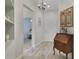 Entryway with wood floors, built-in shelves, and view to the living room at 2160 Antilles Club Dr, Kissimmee, FL 34747
