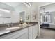 Bathroom with double vanity and view of bedroom at 2160 Antilles Club Dr, Kissimmee, FL 34747