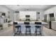 Kitchen with white cabinets, island with seating, and stainless steel appliances at 2160 Antilles Club Dr, Kissimmee, FL 34747