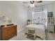 Charming bedroom with an antique dresser and metal bed frame at 2160 Antilles Club Dr, Kissimmee, FL 34747