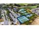 Aerial view of community amenities including tennis courts, pools, and clubhouse at 2160 Antilles Club Dr, Kissimmee, FL 34747