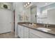 Double vanity bathroom with a large mirror and a walk-in shower at 2160 Antilles Club Dr, Kissimmee, FL 34747