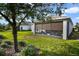 Home exterior showcasing a large backyard and screened-in porch at 2160 Antilles Club Dr, Kissimmee, FL 34747