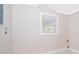 Laundry room with a window and neutral wall paint at 3703 Wade Rd, Orlando, FL 32808