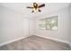 Bright bedroom featuring wood-look floors and ceiling fan at 3703 Wade Rd, Orlando, FL 32808