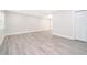 Living room with new flooring and fresh paint at 3703 Wade Rd, Orlando, FL 32808